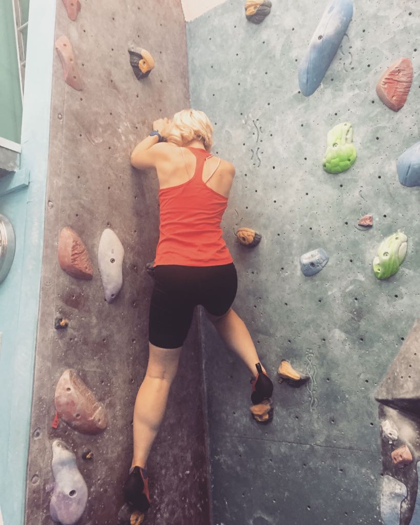 Caroline bouldering at Mile End Climbing Wall